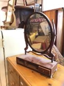 An Edwardian dressing table mirror the oval mirror on rectangular base lacking two drawers,