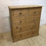 A pine chest of drawers the rectangular moulded top over two short drawers and three long drawers