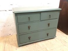 An early 20thc low chest of drawers with moulded rectangular top over two short drawers and two long