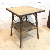 A cane occasional table the square top with woven panel and brass caps to corners on splayed