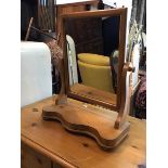 A pine dressing table mirror with serpentine base, (55cm x 46cm x 20cm)