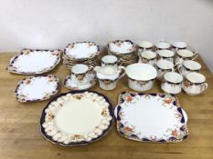 A Heathcote china teaset including twelve teacups, (7cm h), twelve saucers, twelve side plates, milk