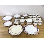 A Heathcote china teaset including twelve teacups, (7cm h), twelve saucers, twelve side plates, milk