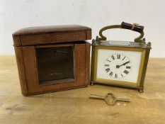 An early late 19th early 20thc carriage clock of squat form, with glass to top and front, roman