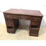 A Victorian mahogany pedestal desk the tooled leather top over three frieze drawers each pedestal