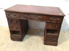 A Victorian mahogany pedestal desk the tooled leather top over three frieze drawers each pedestal