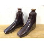 A pair of late 19th early 20thc novelty glazed stoneware bottles in the form of a left and right