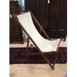 A modern deck chair with canvas seat and folding frame, (upright position 97cm x 56cm x 80cm)