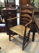 A 19thc elm ladder back open arm chair the ladderbacks with arched centres on curved arms on