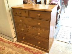 A pine chest of drawers the rectangular moulded top over two short drawers and three graduated
