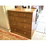 A pine chest of drawers the rectangular moulded top over two short drawers and three graduated