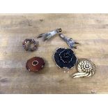 A mixed lot of costume jewellery including a two circular polished stone brooches, two birds feet,