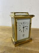 A brass and glass carriage clock, the dial inscribed Forrest, Glasgow with Glasgow Golf Club logo to