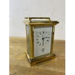 A brass and glass carriage clock, the dial inscribed Forrest, Glasgow with Glasgow Golf Club logo to