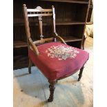 A late 19thc bedroom chair the galleried top rail with inlaid arched surmount over column style