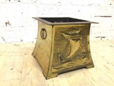 A brass effect log bin with Viking long ship to front and back and drop ring handles to sides, (27cm