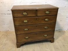 A George III oak chest of drawers the moulded rectangular top over two short drawers and three