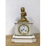 A late 19th early 20thc French mantel clock with gilt metal figure of girl praying on pillow,