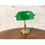 A bankers lamp the green glass shade on brass support (22cm h)