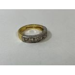 A gold half eternity ring with seven diamonds, size N, weighs 6.82 grammes