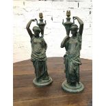 A pair of cast metal table lamps in the form of female water carriers, (55cm h)