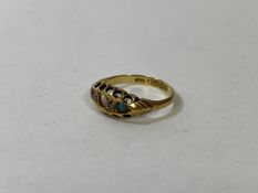 An 18ct gold and gemstone ring, Birmingham, lacking several stones, size N, weighs 2.13 grammes