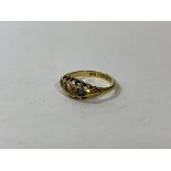 An 18ct gold and gemstone ring, Birmingham, lacking several stones, size N, weighs 2.13 grammes