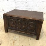 A 19thc pine box with carved panels to four sides on straight square supports (26cm x 47cm x 33cm)