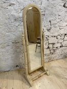 A modern pine cheval mirror, the hinged domed glass on trestle support, ( 144cm high)