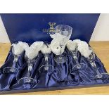 A set of six Gleneagles crystal wine glasses with etched floral decoration,