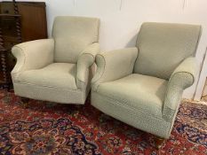 A pair of easy chairs the scrolled back over scrolled arms on turned front supports