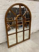 A Jukes Ltd modern conservatory mirror with a domed top,