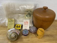 A mixed lot including two glass paperweights, a treen lidded box