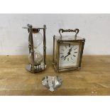 An Astral carriage style clock with battery operated movement,