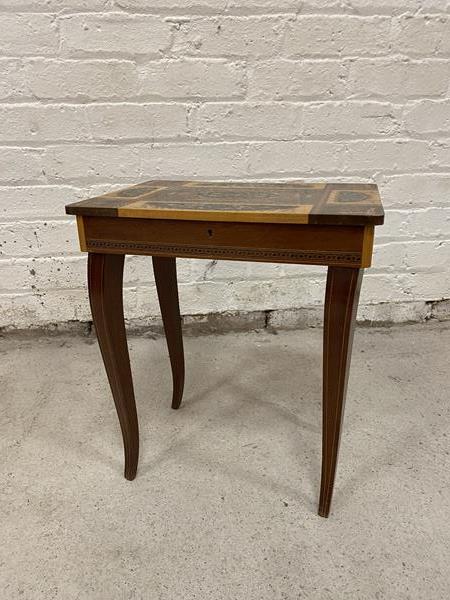 A 1950's / 60's sewing table with inlaid top, hinge a/f, fitted interior, on cabriole supports and