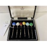 A set of six coffee bean spoons with enamel backs, marked England, in Walker and Hall box, each