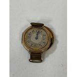 A 1920's / 30's wrist watch lacking strap, case marked .325, measures 2.5cm x 2.5cm