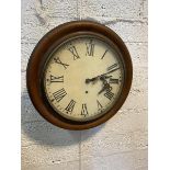 An Edwardian circular wall clock with moulded mahogany frame and hand painted roman numerals to