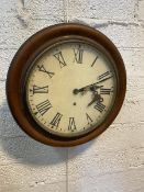 An Edwardian circular wall clock with moulded mahogany frame and hand painted roman numerals to