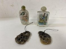 Two modern Chinese reverse painted snuff bottles, one lacking spoon, and two carved stone