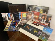 A collection of records including Huey Lewis and the News, Aha, Sound of Music, Tears for Fears (12)