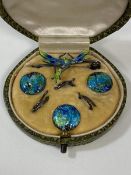 A boxed set of early 20thc Art Nouveau style buttons each with enamel decoration with matching