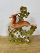 A 19thc Staffordshire pottery flatback spill vase figure of a dog chasing a hind, (29cm high)