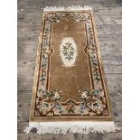 A Chinese runner, central panel with floral decoration with matching border, (184cm x 92cm (