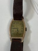 A 1920's gentlemans wrist watch, on leather strap, case marked 375, measures 4cm x 2.5cm