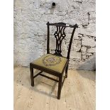 A 19thc side chair, top rail with scrolled corners over intricately pierced splat over drop in