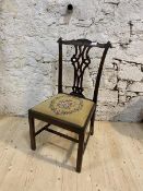 A 19thc side chair, top rail with scrolled corners over intricately pierced splat over drop in