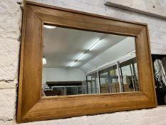 A large contemporary rectangular oak framed wall mirror,