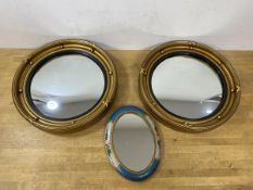 A pair of convex butler's mirrors in composition frames, (32cm), an oval mirror with painted