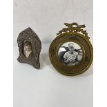 An early 20thc Birmingham silver photo frame, measures 10cm x 7cm, and a gilt metal circular frame